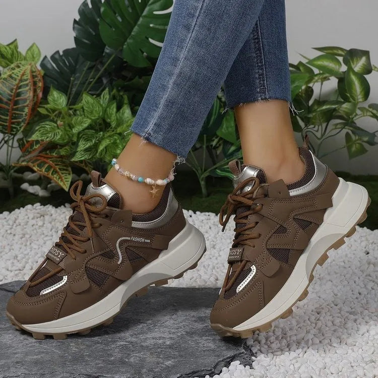 Brown casual clunky sneakers with round toe, lace-up closure, and flat rubber sole on a neutral background