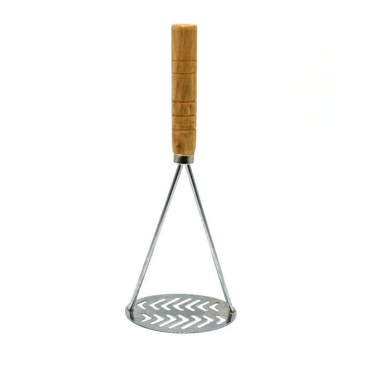 Manual potato masher with wooden handle and flower-shaped iron plated press head on a light surface