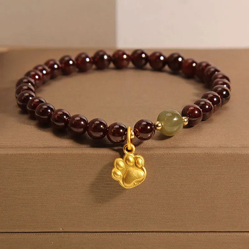Women's adjustable crystal bracelet with Cat's Paw garnet colouration and original design