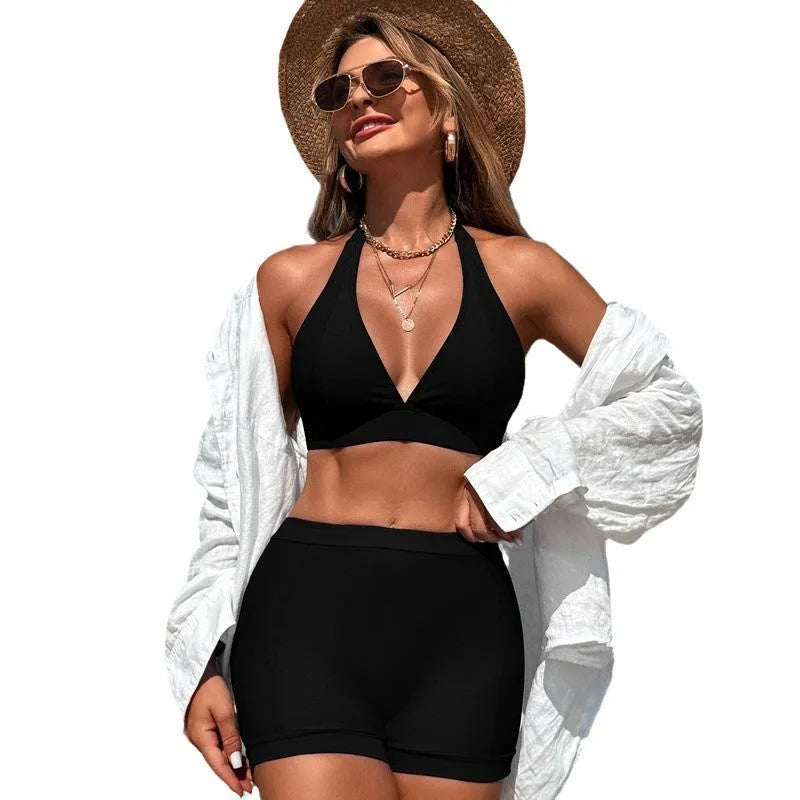 Women's black nylon bikini swimsuit with polyester lining, shown on a mannequin.
