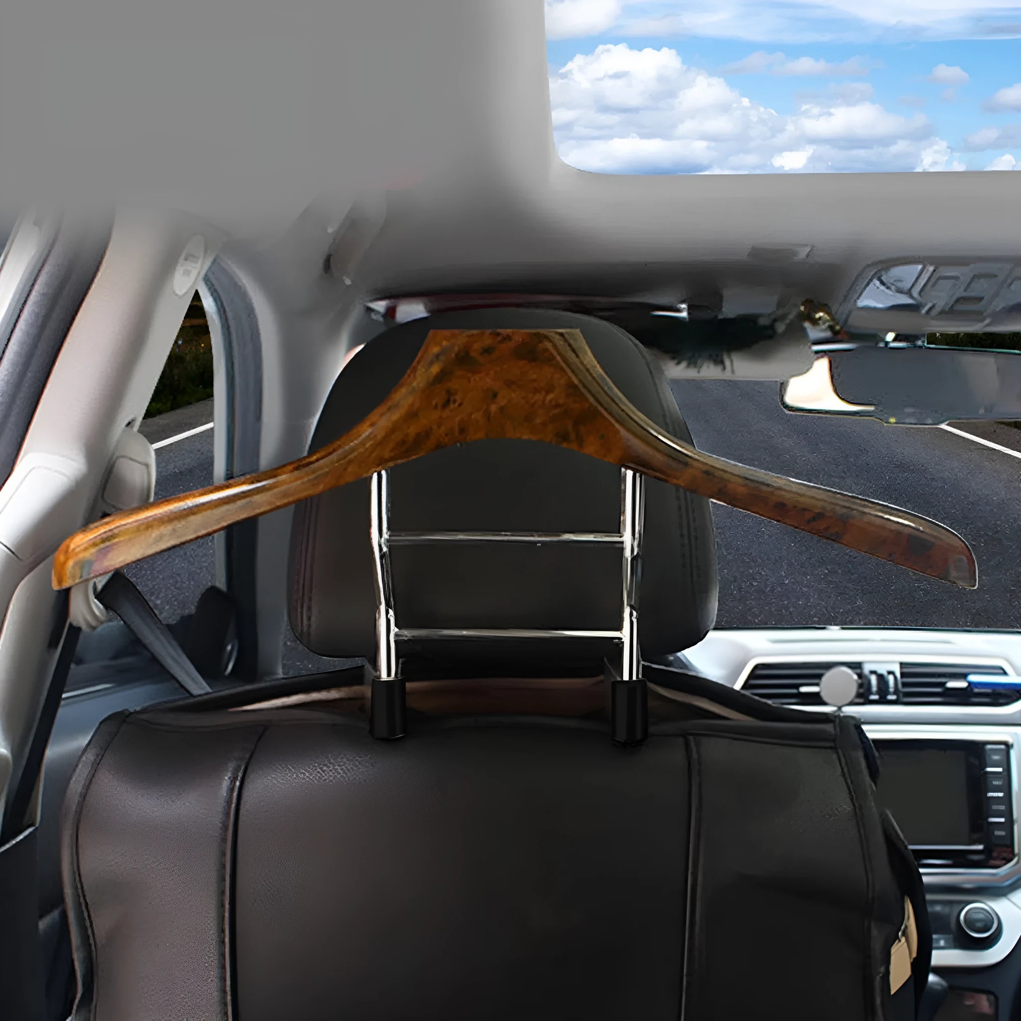 Stainless steel car clothes hanger with wood yellow finish hanging over car seat