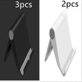 Black PE plastic folding stand holding a tablet at an adjustable angle on a wooden desk.