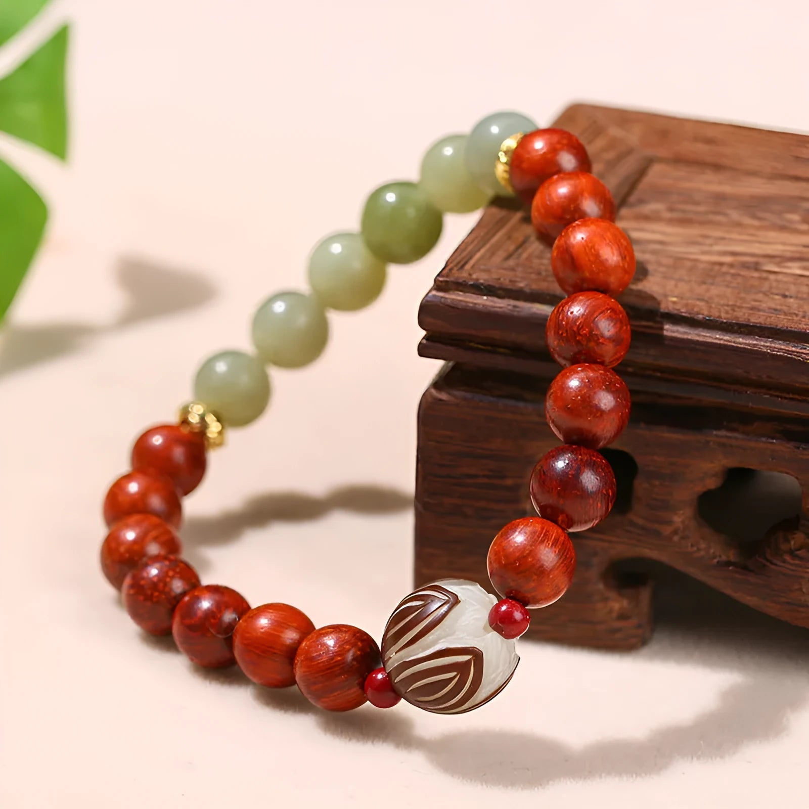 Red rosewood and gray jade women's bracelet with 8mm Bodhi Lotus charm in Chinese style geometric design