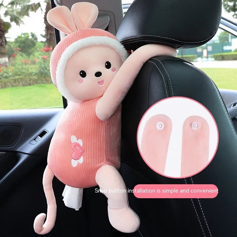 Plush fabric car seat back tissue box holder with animal character design mounted behind car headrest