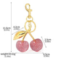 Red three-dimensional zinc alloy pendant for a keyring or women's bag.