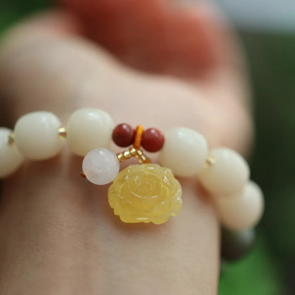 Natural bodhi root bracelet with 10mm beads in gradient white jade colour and lotus pendant