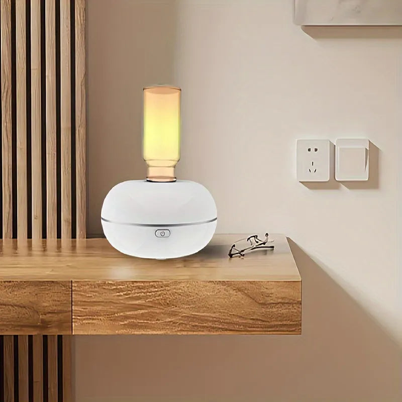 Automatic sensor fragrance machine mini USB home indoor air diffuser inverted aromatherapy in white colour on bathroom counter.