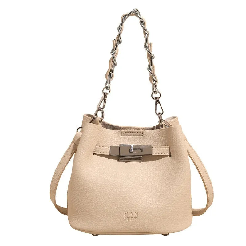 Soft PU leather retro bucket shoulder bag with chain detail in four colour options.