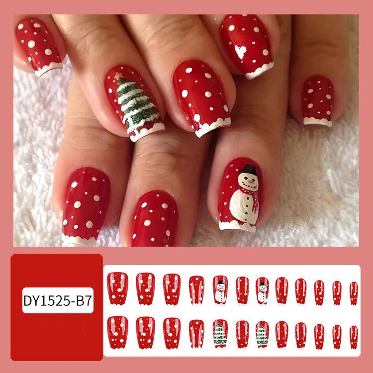 Christmas false nails with festive hat, striped, and snowflake designs for holiday parties