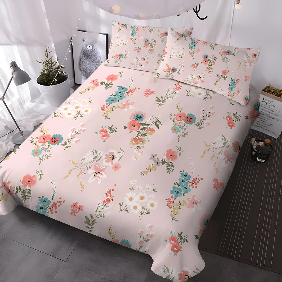 Pink floral microfiber duvet set with two pillow shams on a bed
