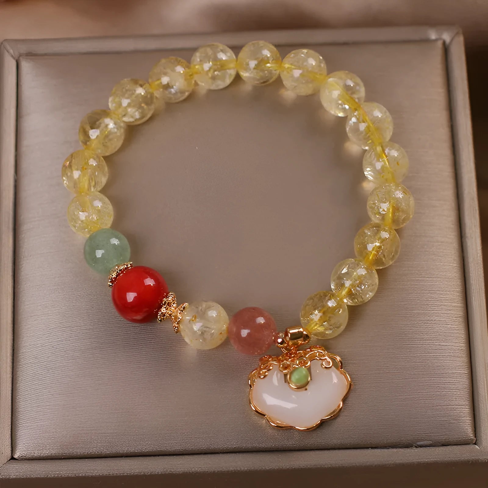 Women's alloy bracelet with a yellow natural citrine jade ruyi pendant.
