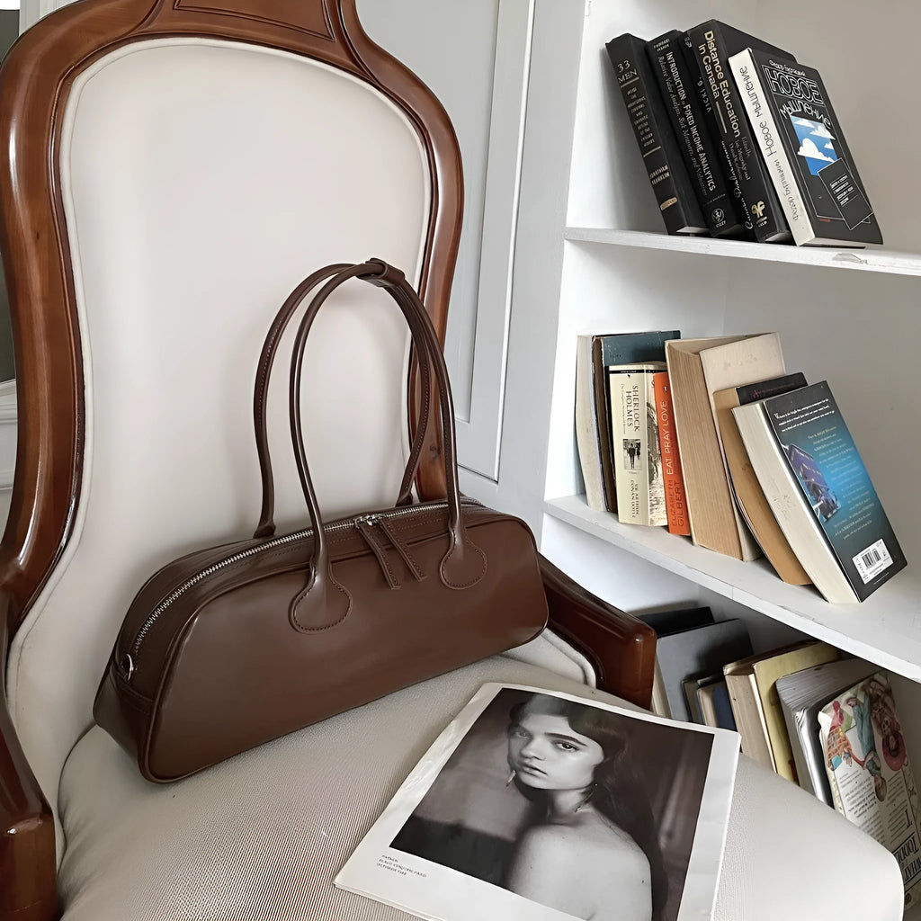 Women's genuine leather first layer cowhide oval single-shoulder bag in Brownie Brown colour with sewing thread detailing