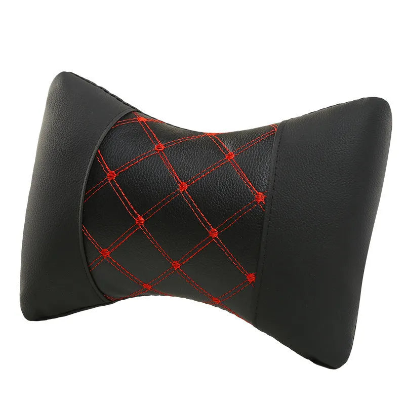 Black diamond quilted car headrest pillow with contrast stitching for neck support.