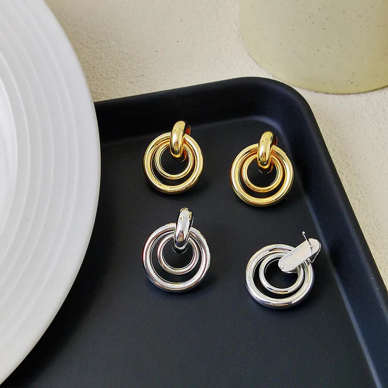 Geometric round ring earrings with irregular design in gold and silver colour options