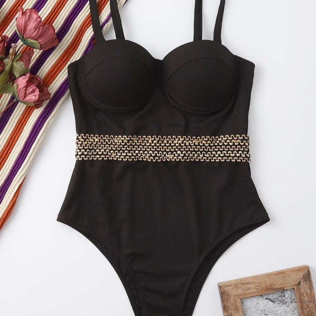 Black one-piece swimsuit for women with a matching hard storage bag featuring an adjustable shoulder strap.