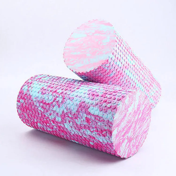 Solid EVA foam yoga roller in pink and blue, 30cm and 45cm lengths, on a yoga mat