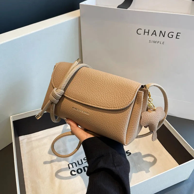 Soft PU leather small shoulder bag in khaki, pillow shape, 21cm width, with visible sewing thread details