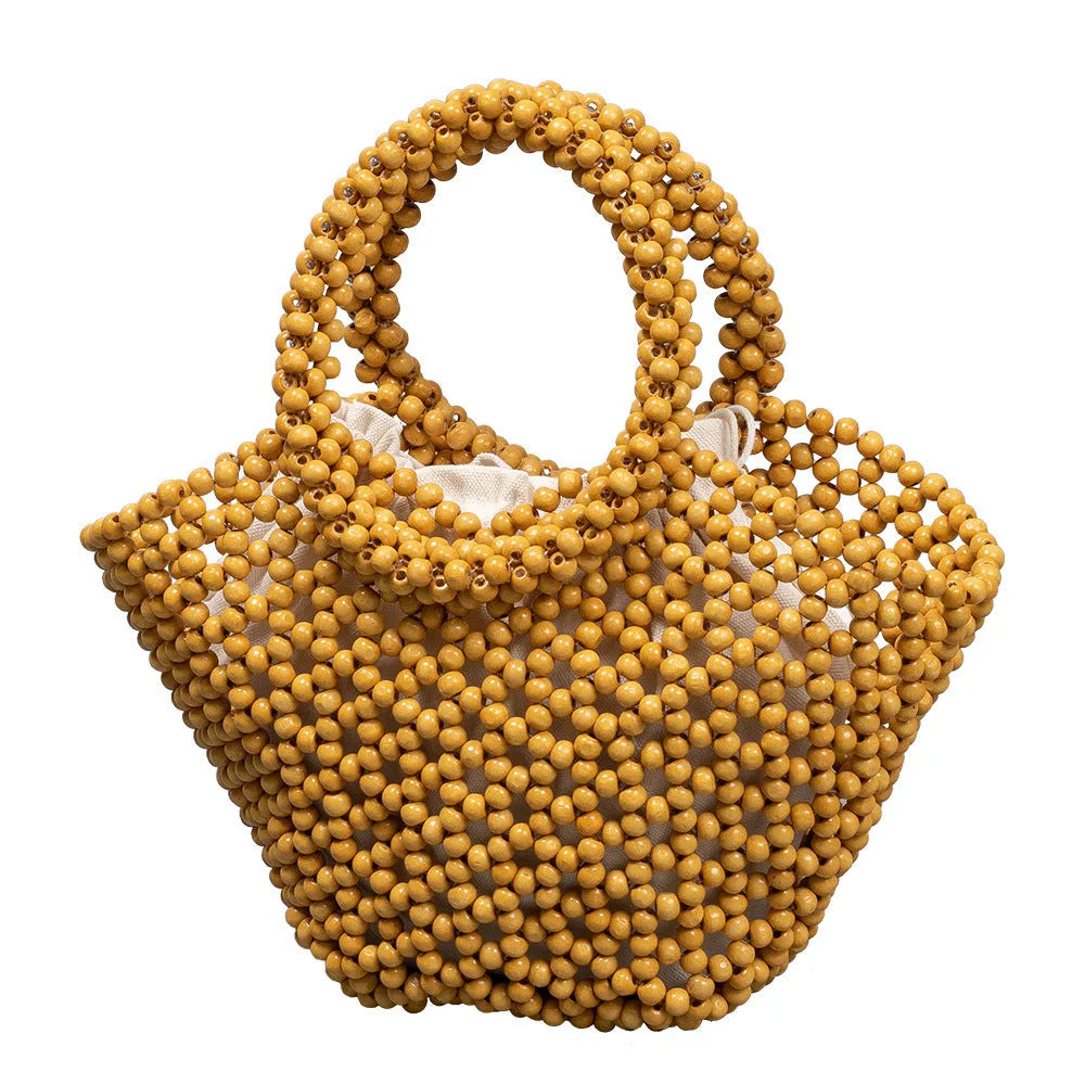 Maple wood woven dumpling-shaped handbag with wooden bead decoration, shown in milky white.