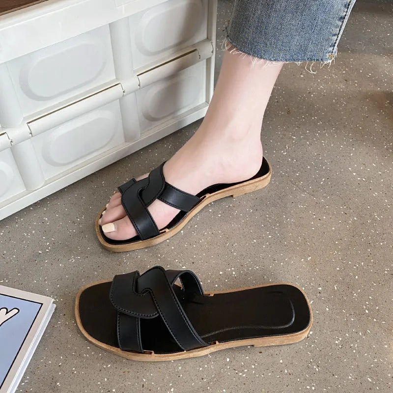 Women's PVC cross-strap flip-flop sandals in milky white, shown for home casual wear.