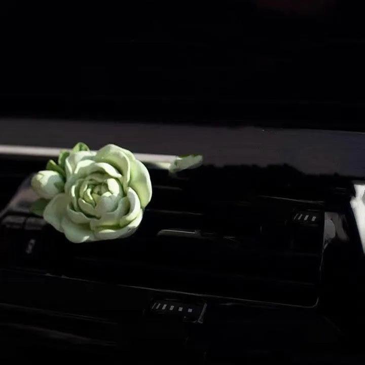Gypsum solid car air freshener with jasmine oil clipped to vehicle vent