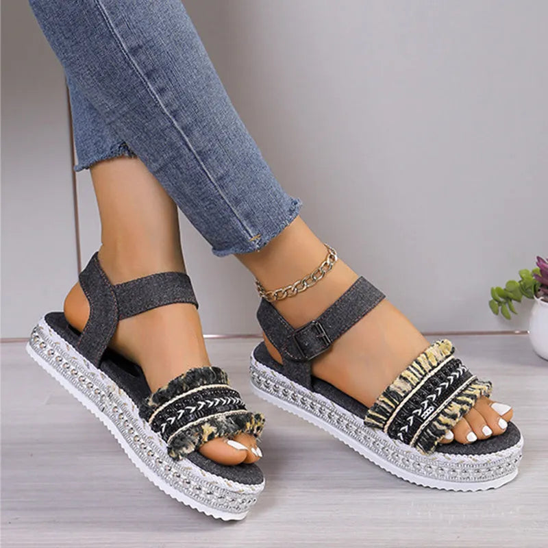 Women's tassel denim sandals with thick flat sole and buckle closure in blue