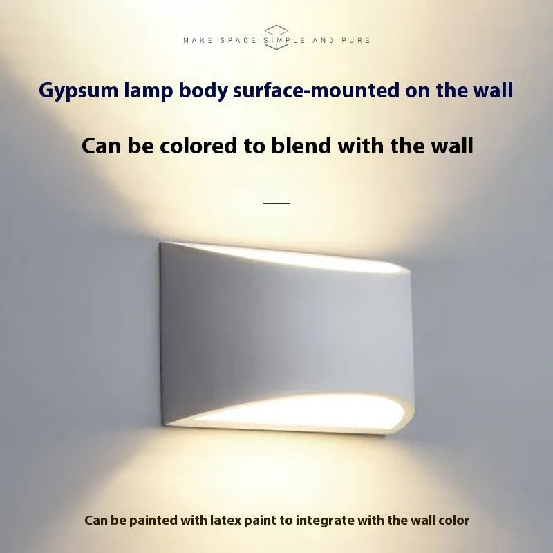 Simple Nordic plaster wall lamp with ABS shade mounted on a light-coloured wall