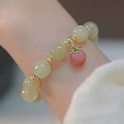 National style bracelet with rabbit charm, coloured glaze and glass beads, peace buckle clasp
