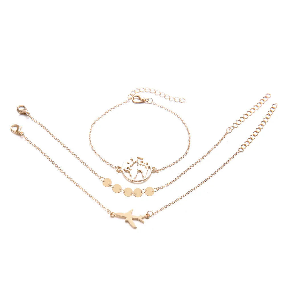 Set of three bohemian-style women's bracelets with heart-shaped aircraft map charms in alloy.