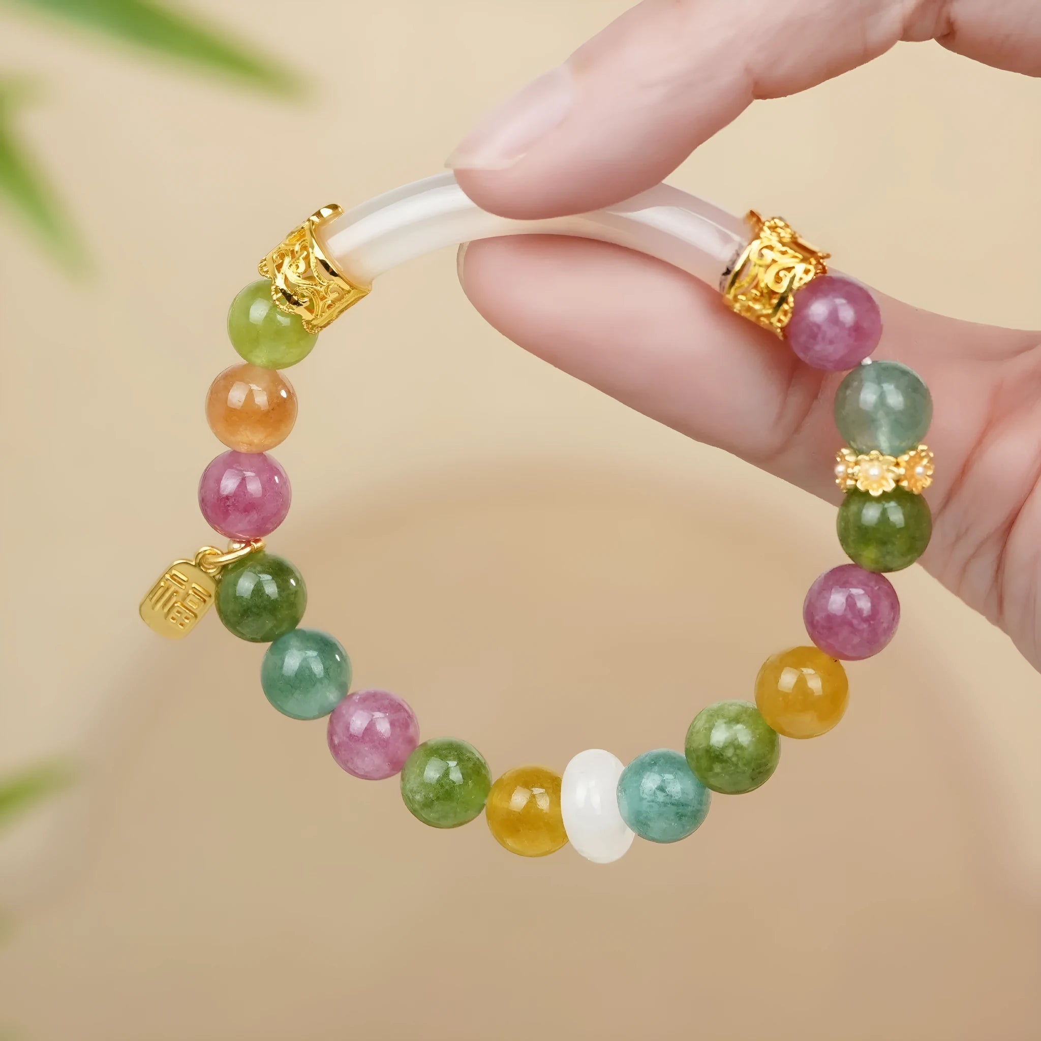 Rainbow coloured electroplated half bracelet for women made from jade and tourmaline.