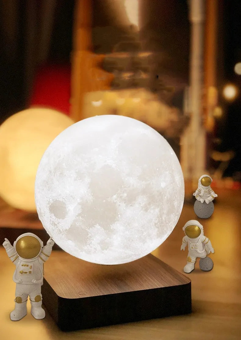 Maglev moon and planet night light with floating models, three astronaut figurines, and LED glow