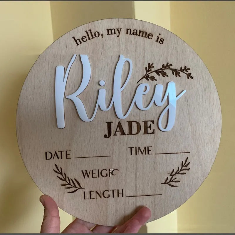Square wooden baby name label showing birth details, 15cm on each side, in one of three style options.