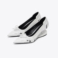 Black women's pointed toe Mary Jane shoes with a floating special-shaped heel on a white background.