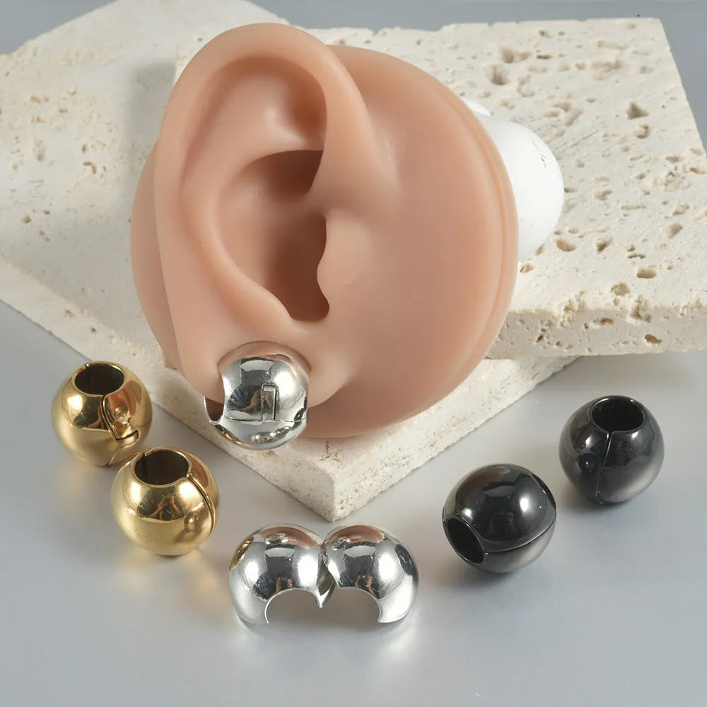 Stainless steel hollow skull and Buddha head geometric ear cuff for hip hop style.