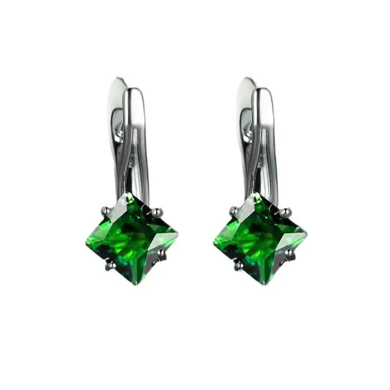 A pair of women's copper earrings with a diamond design made from inlaid zircon stones.