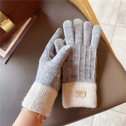 Winter mittens with embroidered stripes in various colours for warmth and style