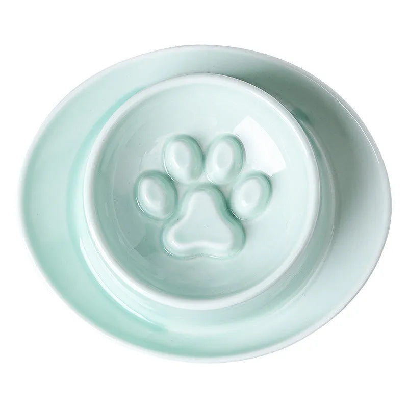 Ceramic slow feed pet bowl in green with internal ridges and neck protection design.