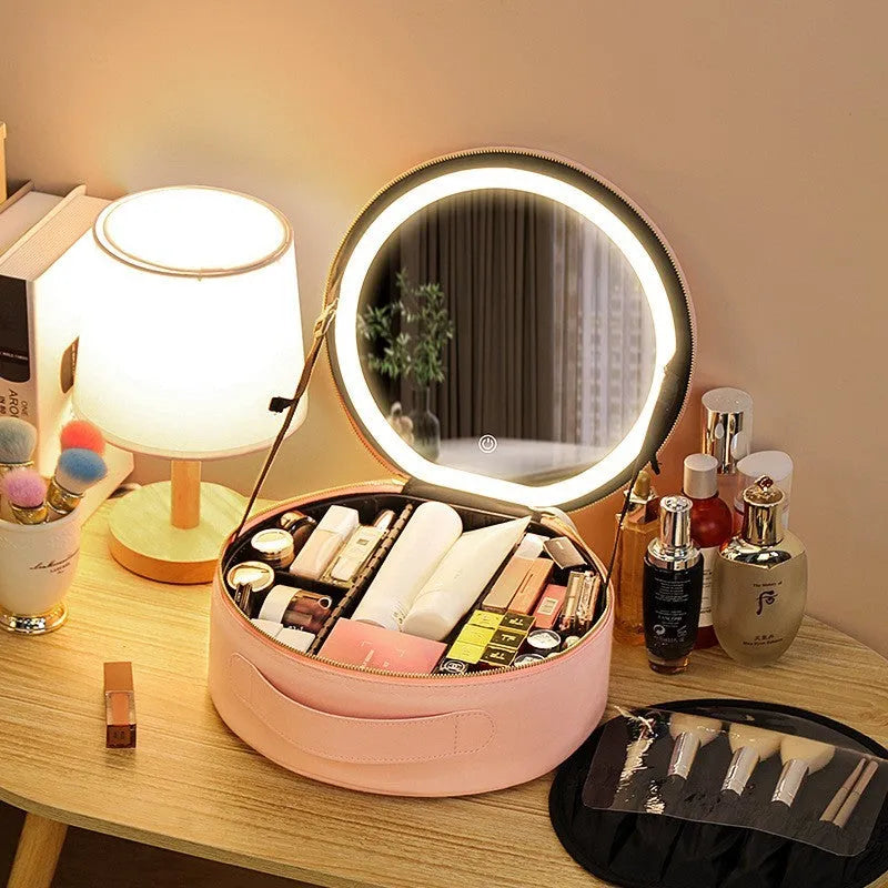 Round pink LED makeup bag open showing internal partitions and illuminated mirror.
