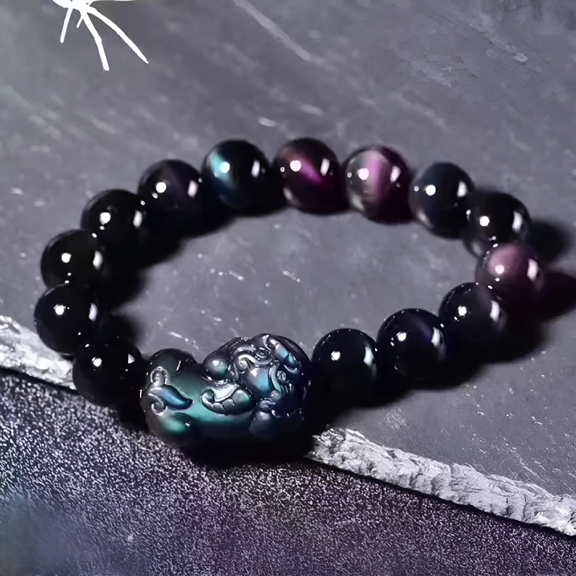 Natural Ice Obsidian beaded bracelet on wrist showing pale crystal beads.