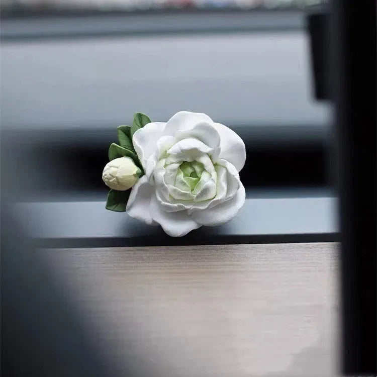 Gypsum solid car air freshener with jasmine oil clipped to vehicle vent