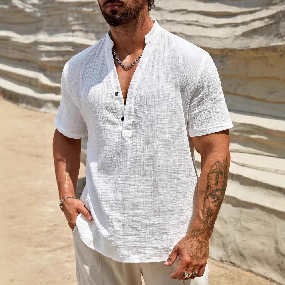 Men's solid colour short-sleeved shirt with a stand collar on a hanger.