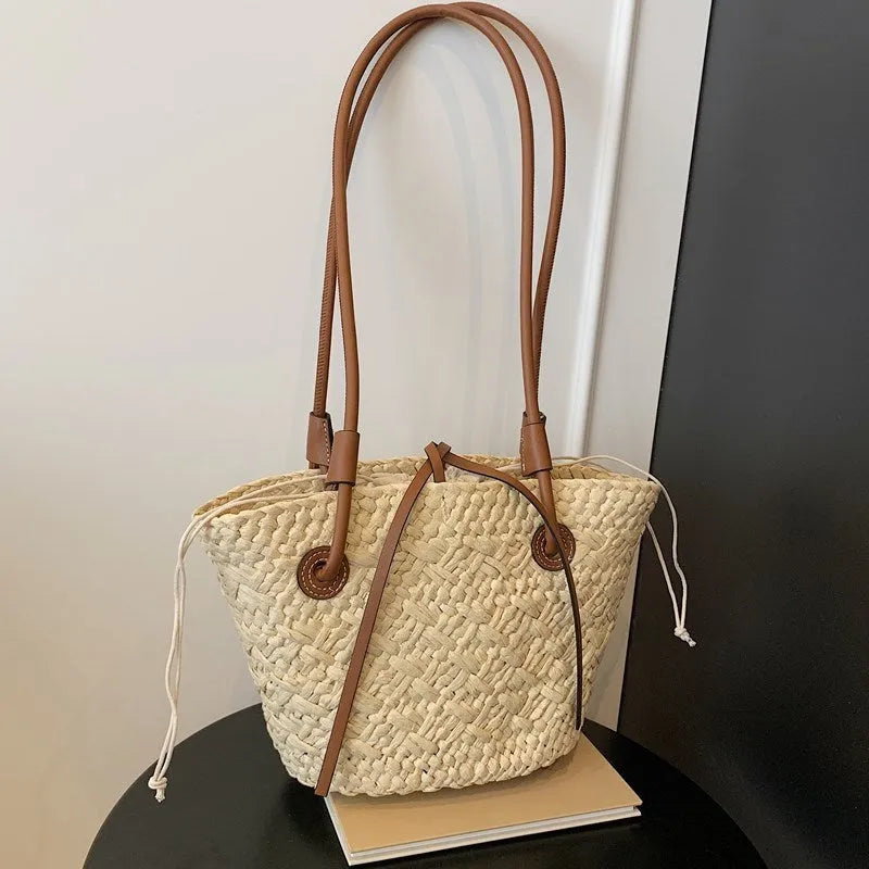 Beige and khaki woven bag with large capacity and dual shoulder or hand-carrying options in retro style