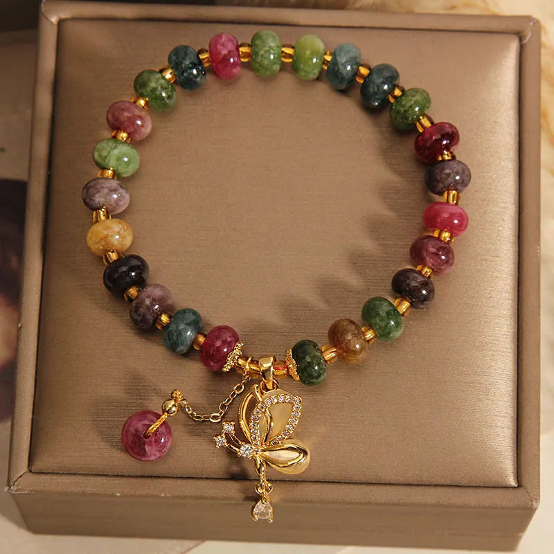 Colourful alloy bracelet for women with a butterfly charm and tourmaline beads on a fresh sweet style band.