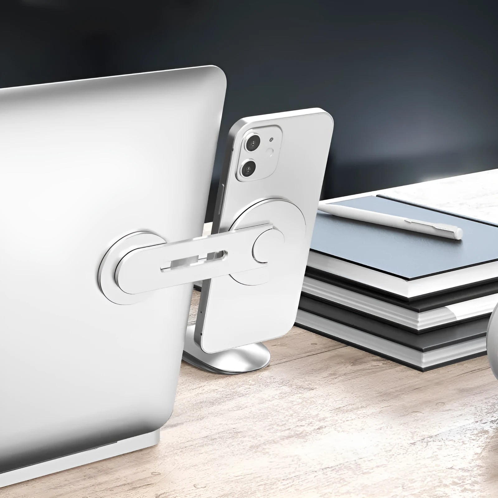 Silver magnetic phone holder for Tesla cars, showing its slim profile and 180-degree flip mechanism.