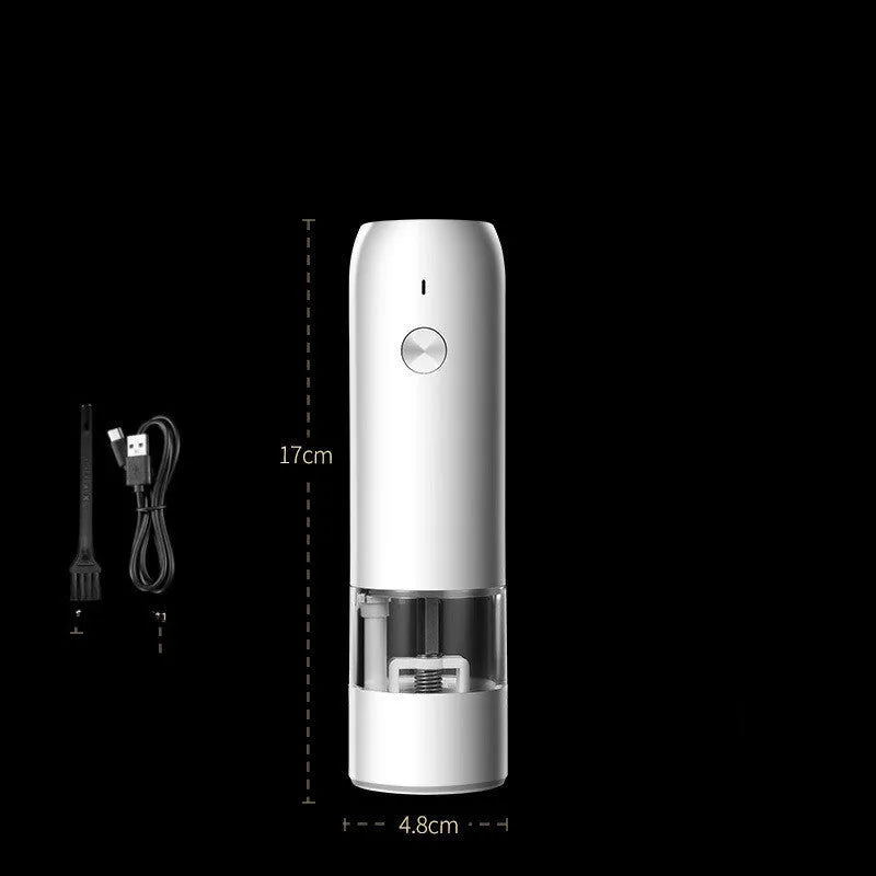 Black and white rechargeable electric pepper and salt grinders with clear acrylic bodies on a kitchen counter.