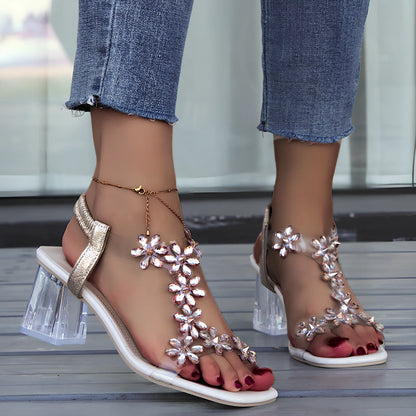 Women's fashion sandals with transparent square heels and decorative flowers, square toe design in black plum colour