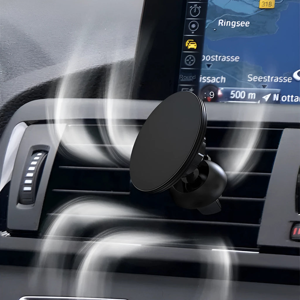 Black aluminium alloy magnetic car air vent phone holder attached to vehicle dashboard vent.
