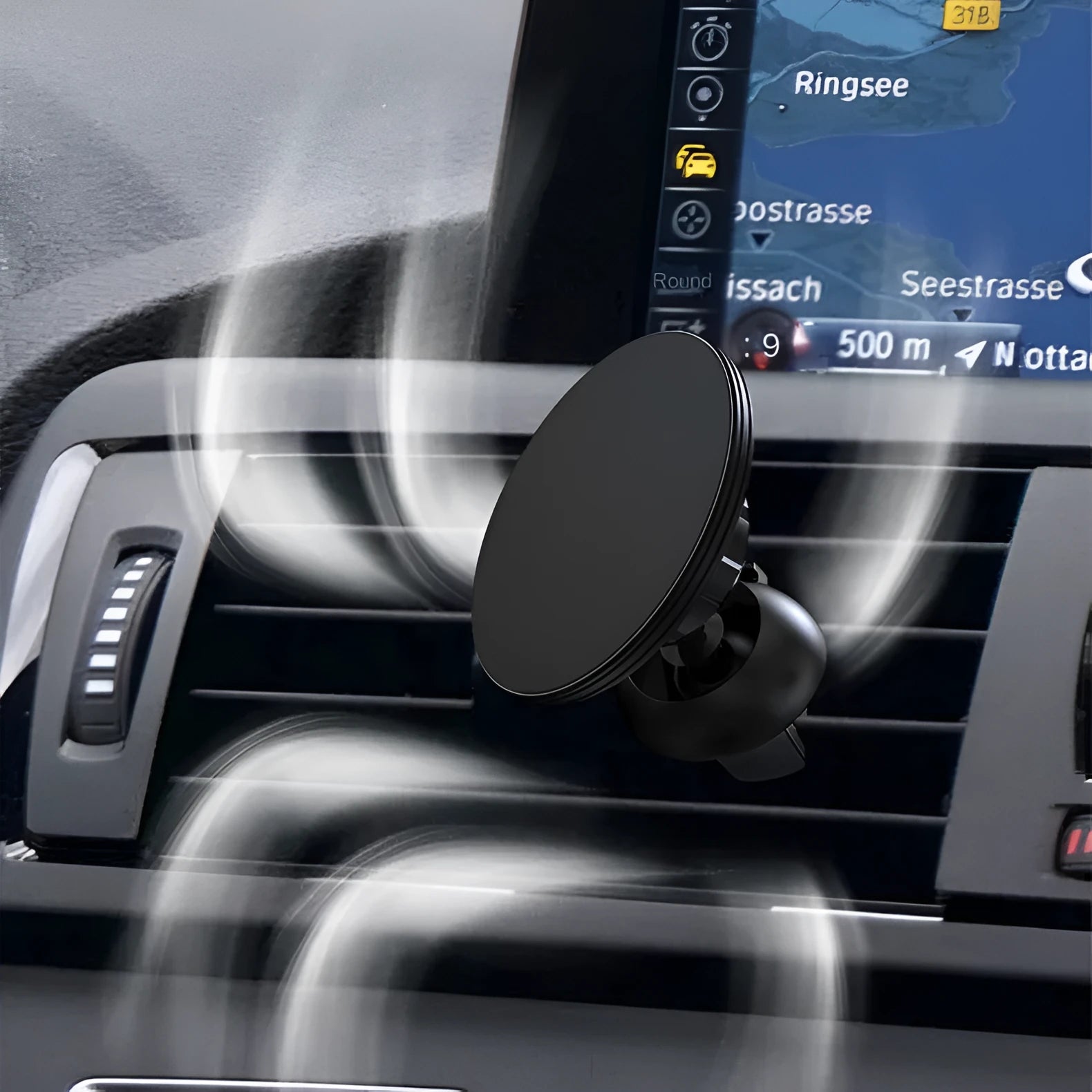Black aluminium alloy magnetic car air vent phone holder attached to vehicle dashboard vent.