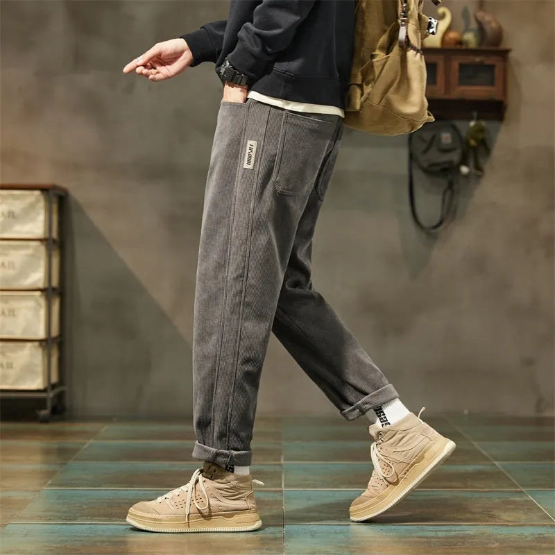 Men's corduroy casual trousers in tapered straight-leg style with mid waist and zip fly