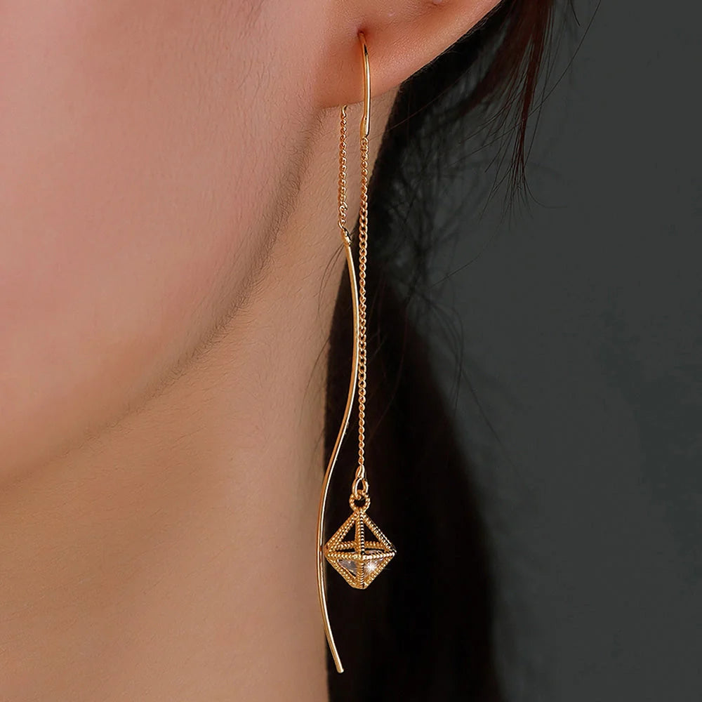 Gold Bronze Cutout Zircon Tassel Earrings with European design and sparkling accents