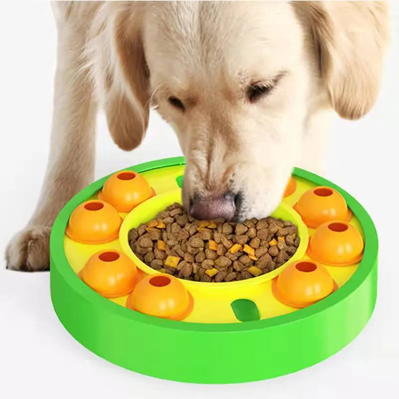 Square green dog puzzle feeder bowl with rotating turntable top and non-slip rubber base.